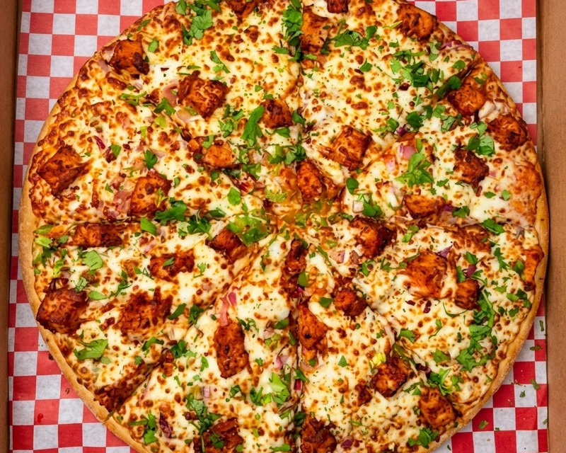 Tandoori Chicken Pizza - Indian-style fusion pizza at City South Pizza Winnipeg
