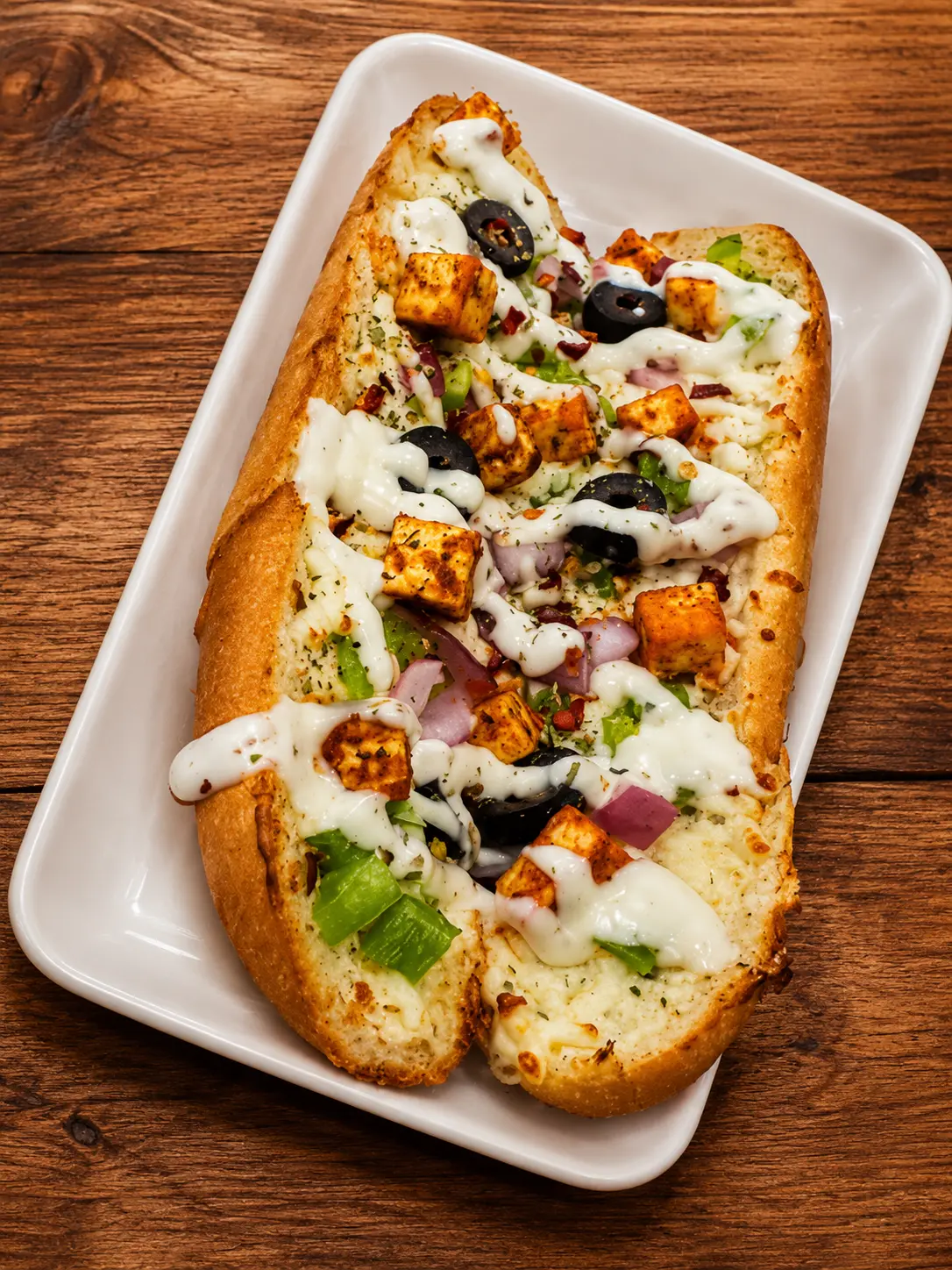 Butter Chicken Pizza topped with rich, creamy butter chicken sauce at City South Pizza Winnipeg